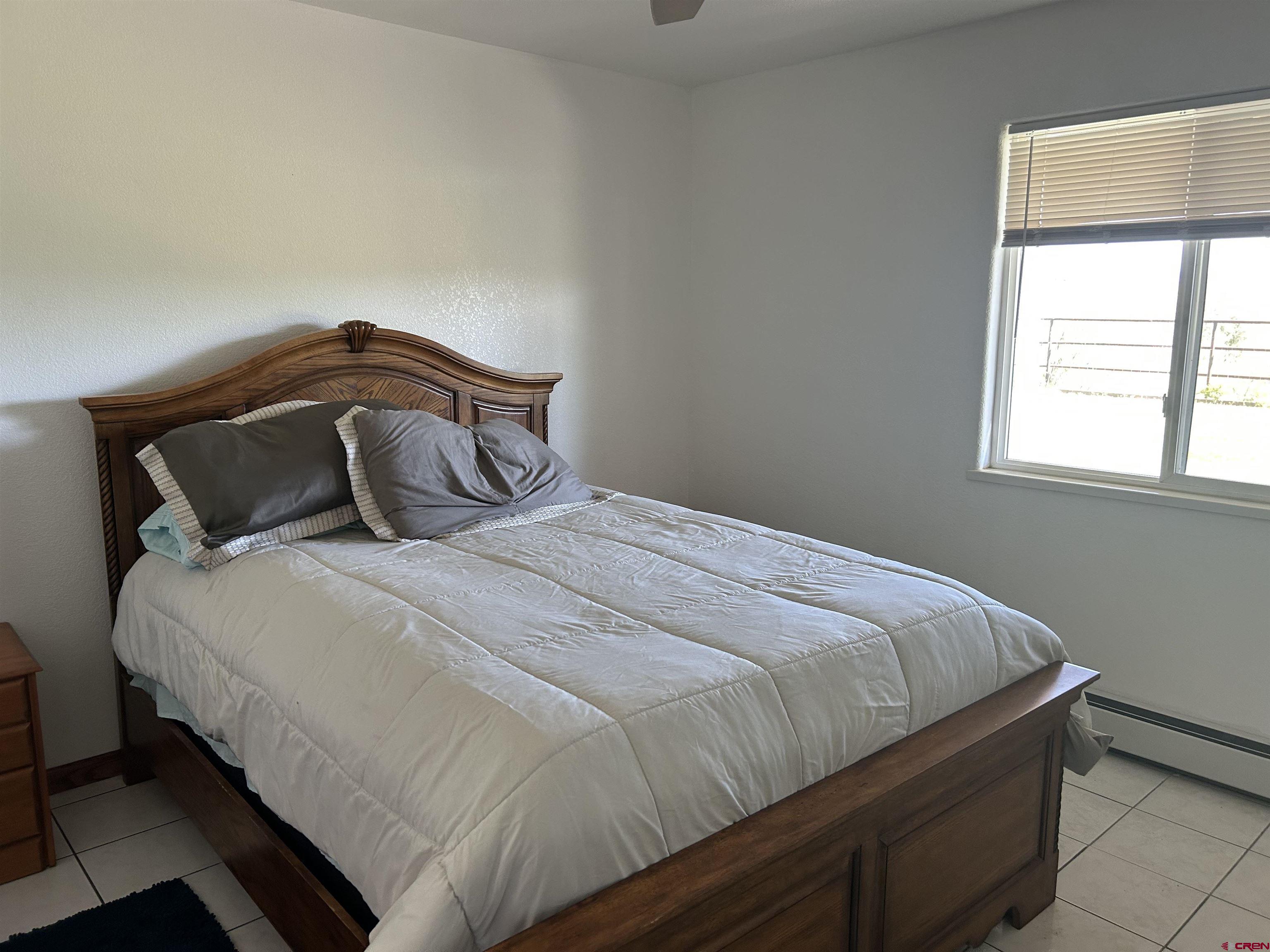 29669 DD Road Nucla, CO 81424 - Photo 25 of 33 a bedroom with a bed and window