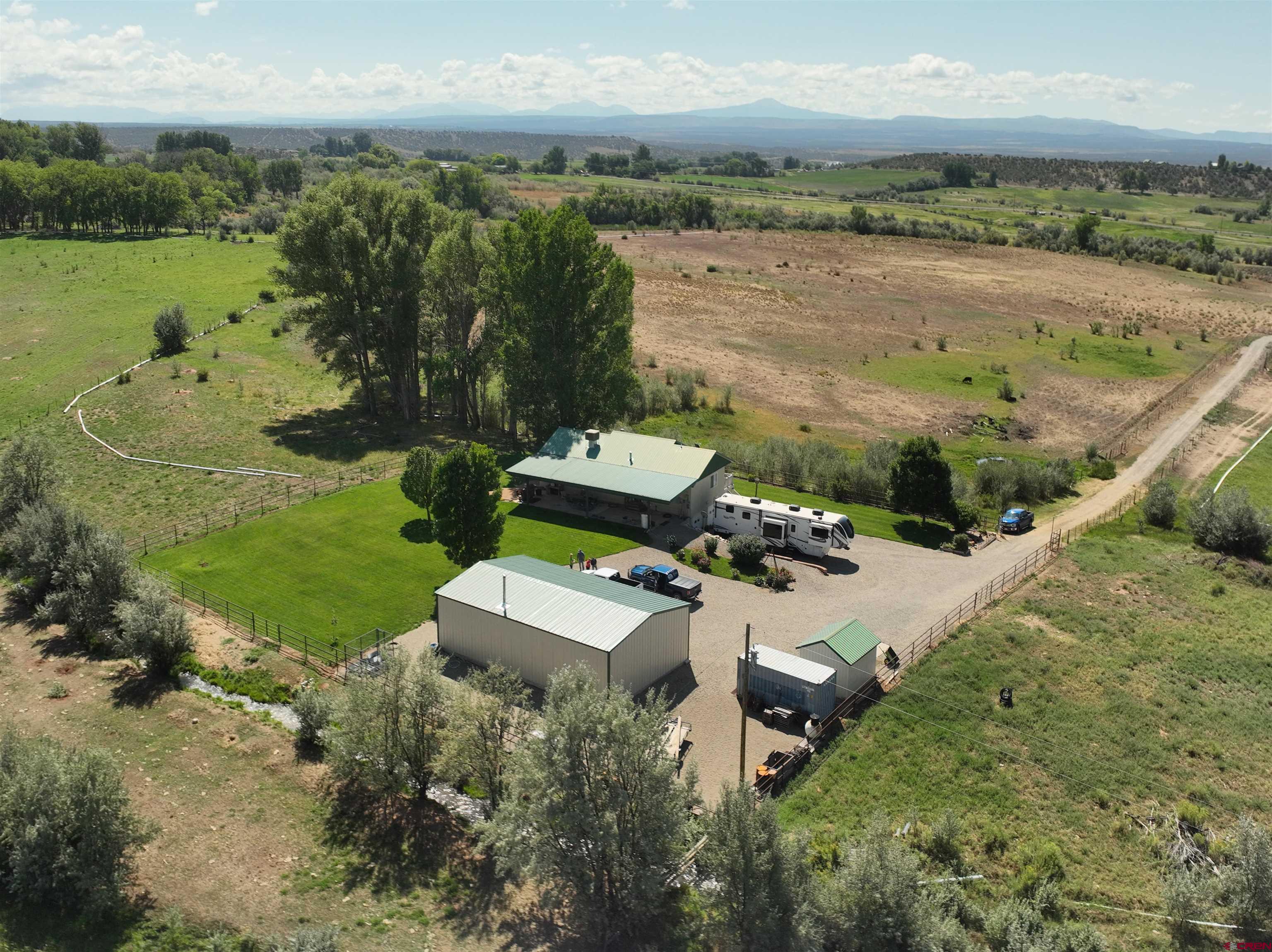 29669 DD Road Nucla, CO 81424 - Photo 3 of 33 an aerial view of a house with garden space and outdoor seating