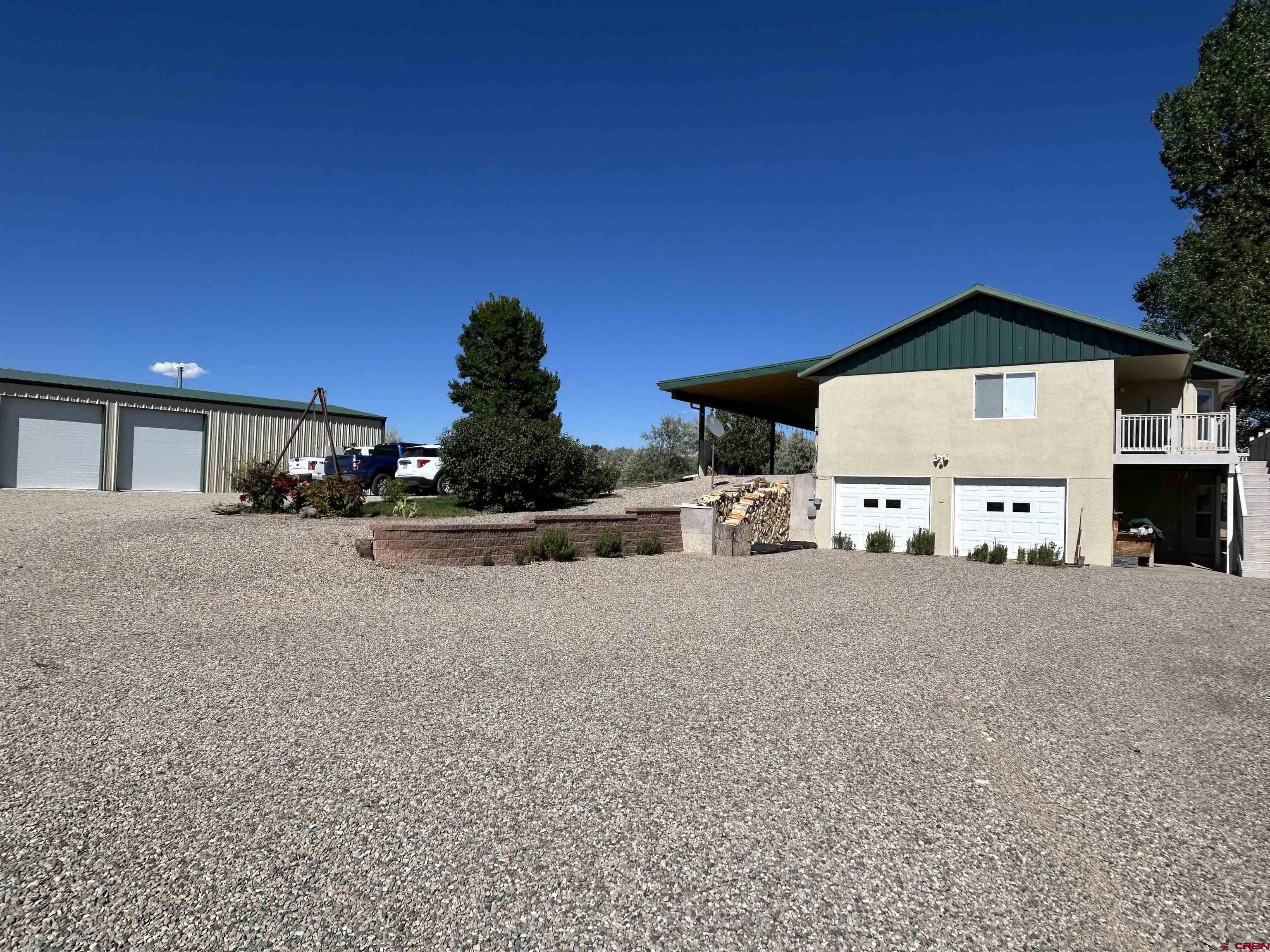 29669 DD Road Nucla, CO 81424 - Photo 32 of 33 a front view of a house with a yard