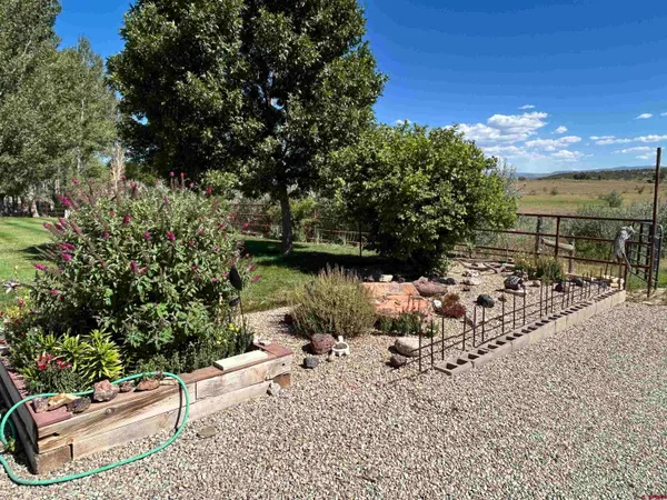 a view of a lake with a yard