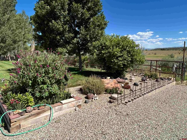 a view of a lake with a yard