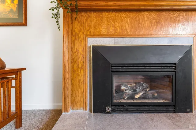 a fireplace with a clock on top of it