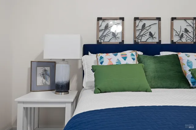 a view of a bedroom with bed and hallway