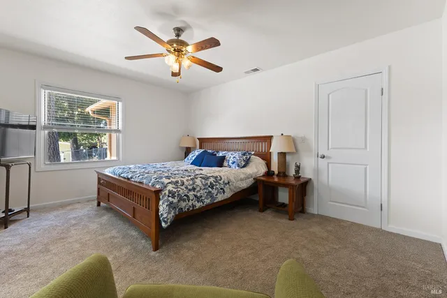 a bedroom with a bed and window