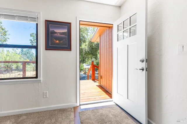 a hallway with a large window and a large window