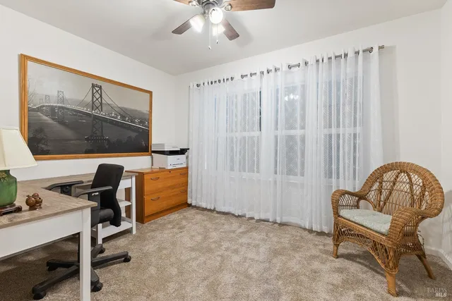 a workspace with a couch and a window