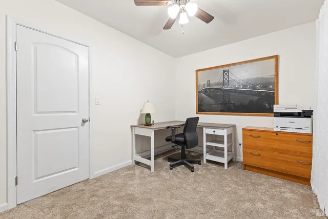 a view of a workspace with furniture