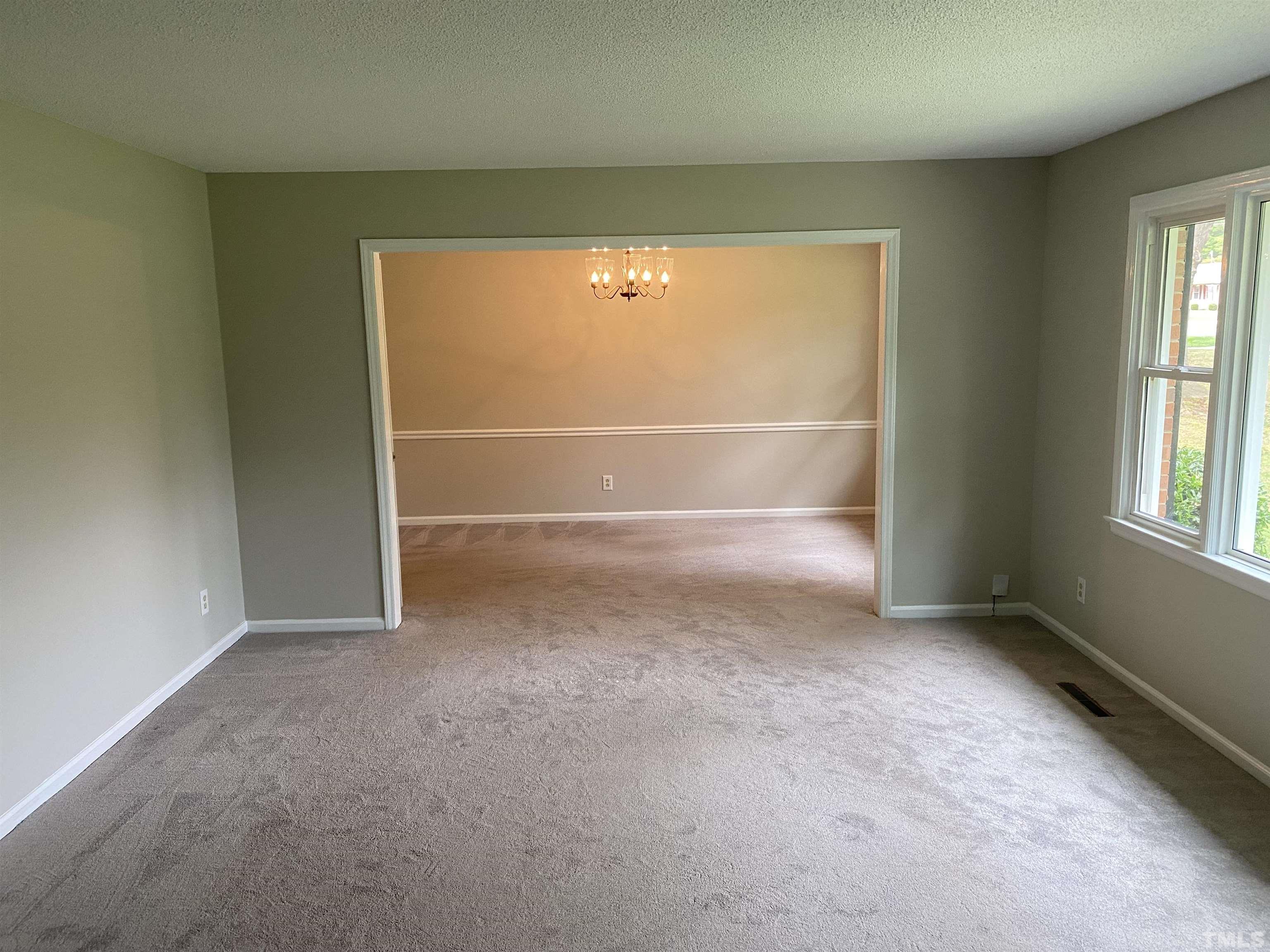4903 Mandel Road Durham, NC 27712 - Photo 3 of 21 Large formal living room leading into formal dining room.