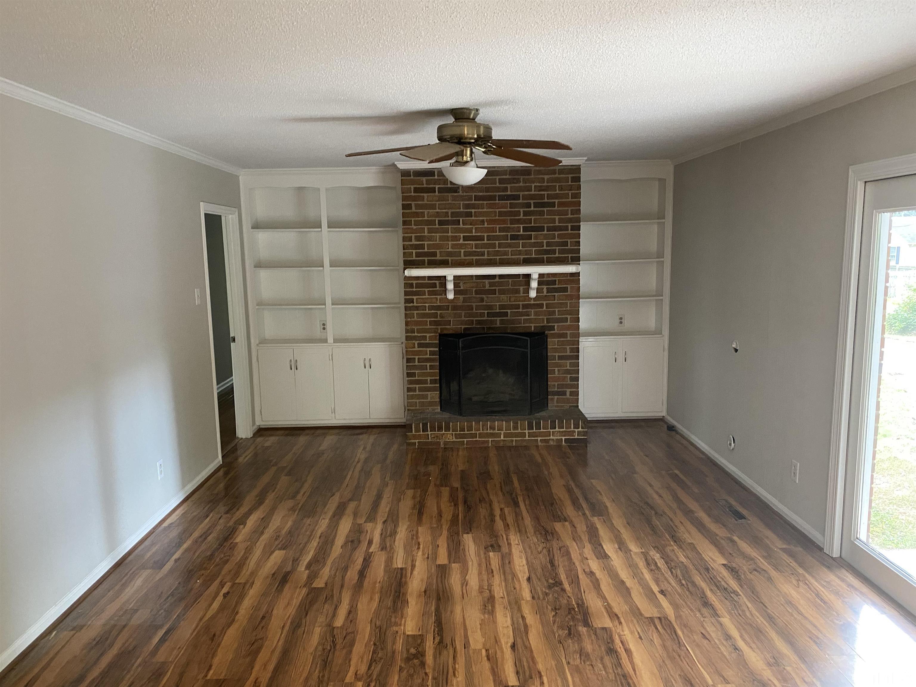 4903 Mandel Road Durham, NC 27712 - Photo 6 of 21 large Den with fireplace and built in bookshelves.