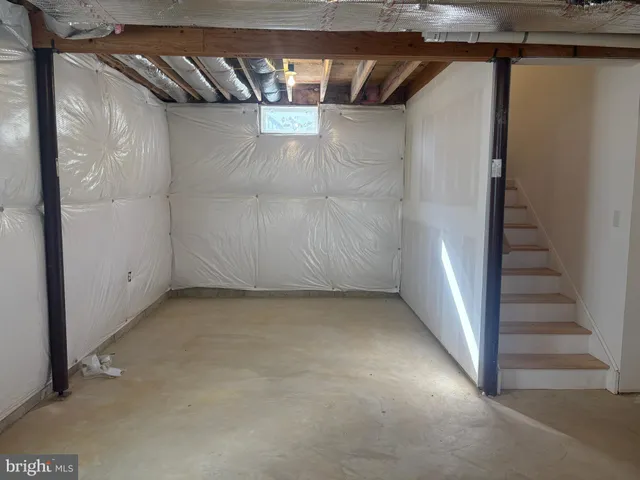 a view of a room with wooden walls