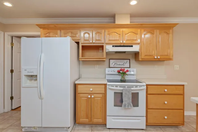 a kitchen with a sink cabinets and appliances