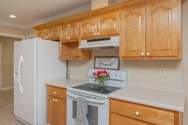 a view of a room with a window and chandelier