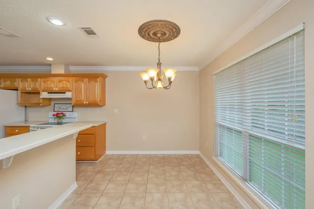 a living room with furniture and a ceiling fan