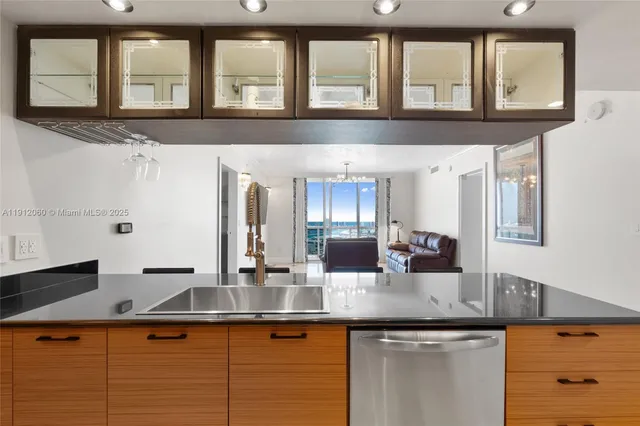 a kitchen with a microwave and cabinets