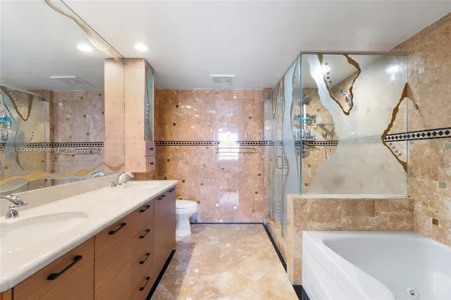 a bathroom with a sink mirror and a shower