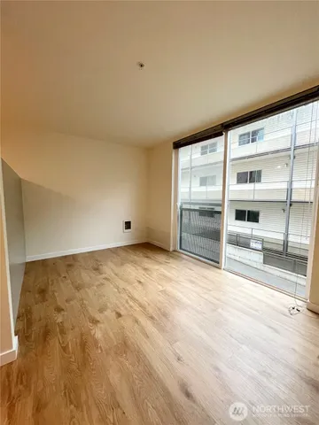 a view of an empty room with a window