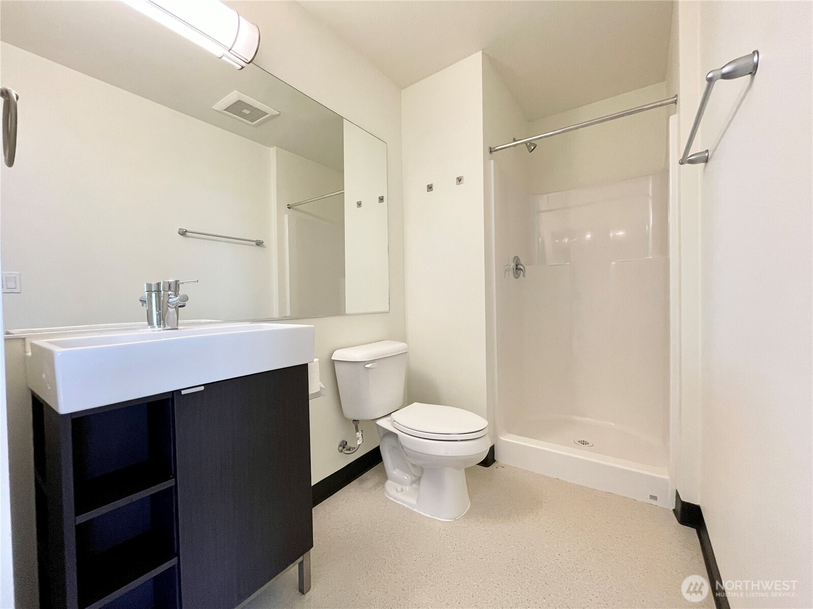 2249 Northeast 46th Street Seattle, WA 98105 - Photo 15 of 20 a bathroom with a sink toilet a mirror and shower