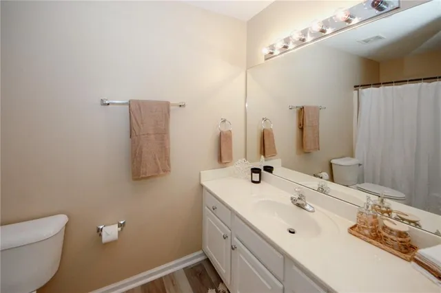 a bathroom with a double vanity sink and mirror