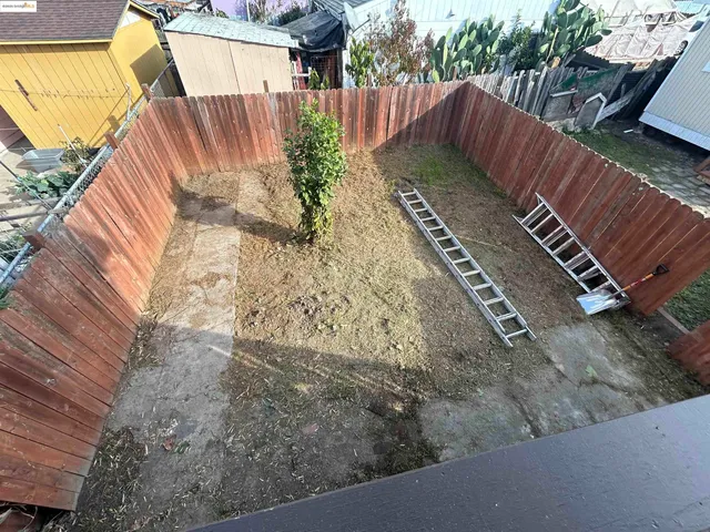 a view of a backyard with sitting area
