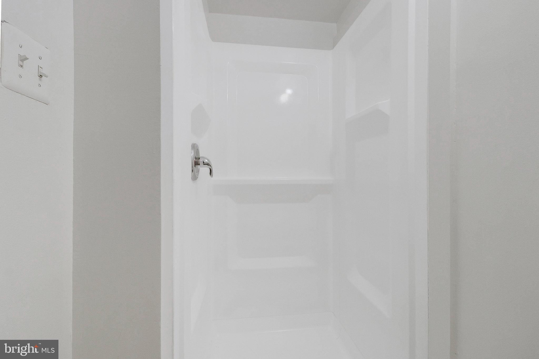 5004 Roanoke Place College Park, MD 20740 - Photo 21 of 27 a bathroom with a shower