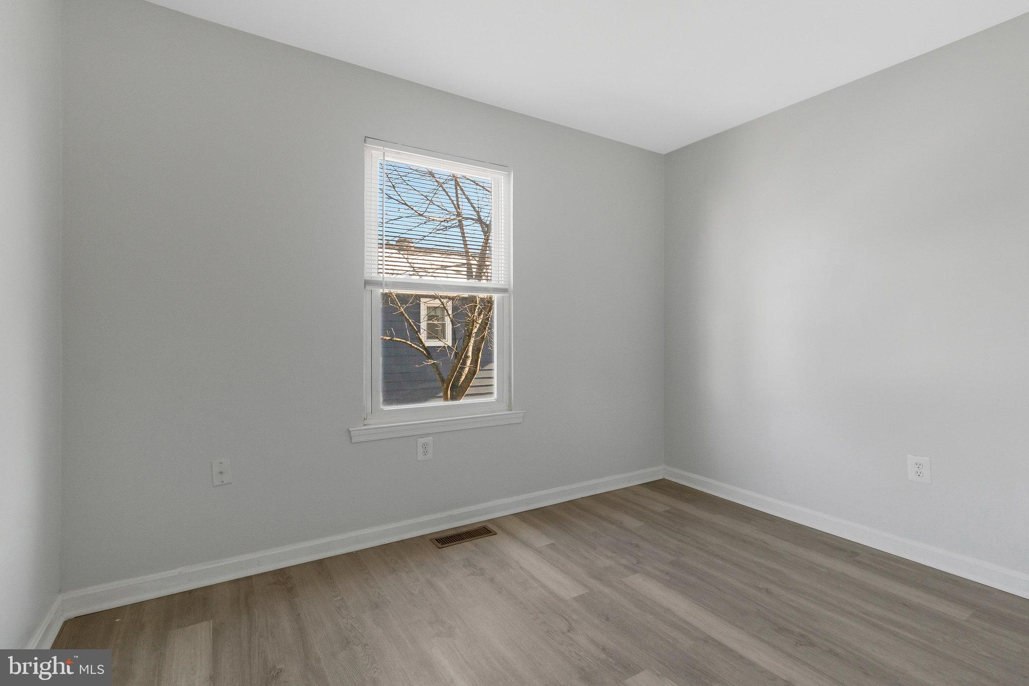 5004 Roanoke Place College Park, MD 20740 - Photo 6 of 27 an empty room with a window