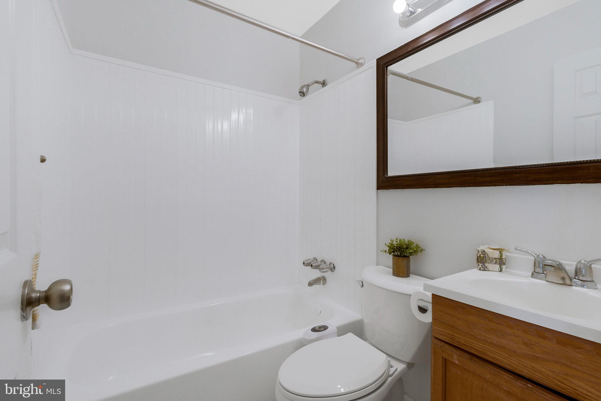 5004 Roanoke Place College Park, MD 20740 - Photo 8 of 27 a bathroom with a sink toilet and shower