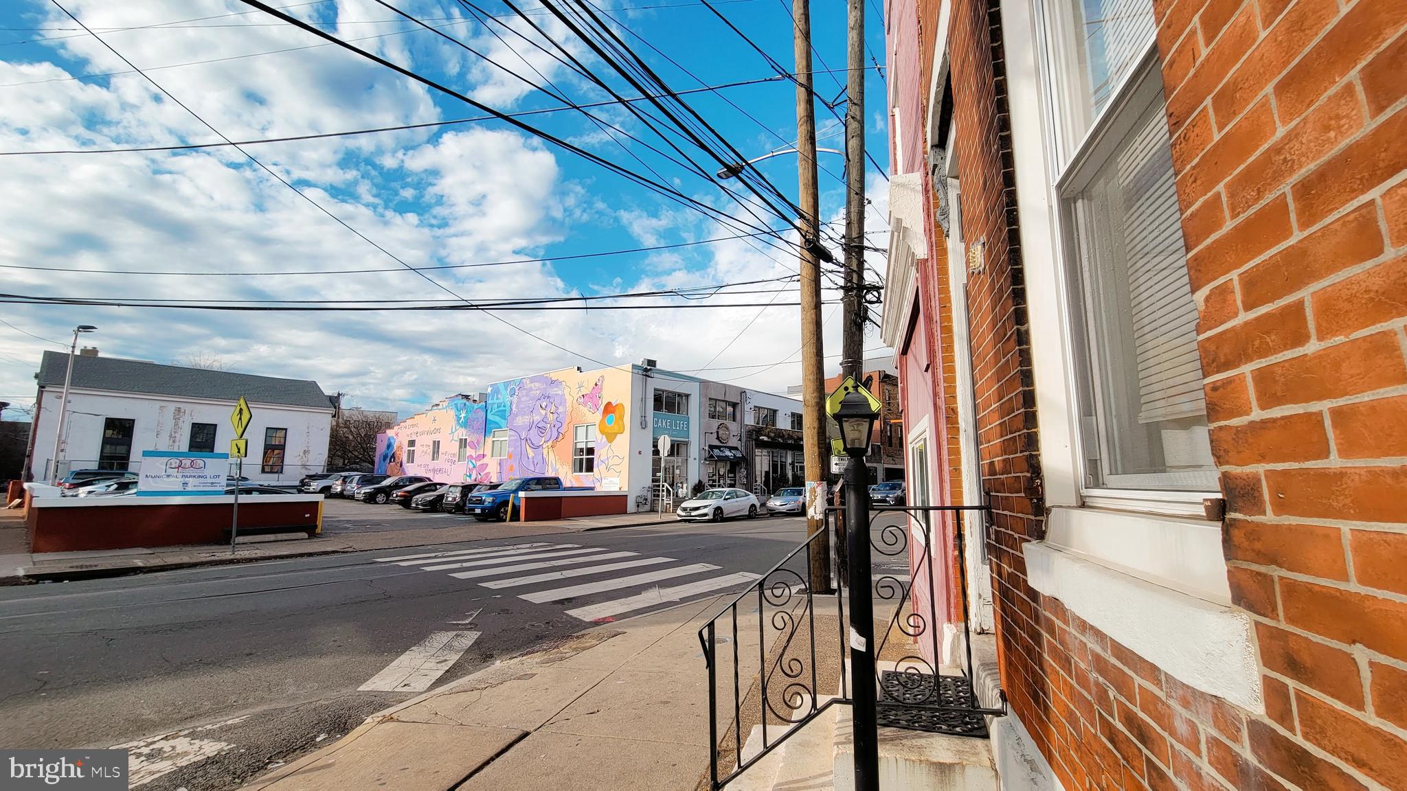 1249 Shackamaxon Street, Unit 3F Philadelphia, PA 19125 - Photo 11 of 12 a view of a street with cars parked on road