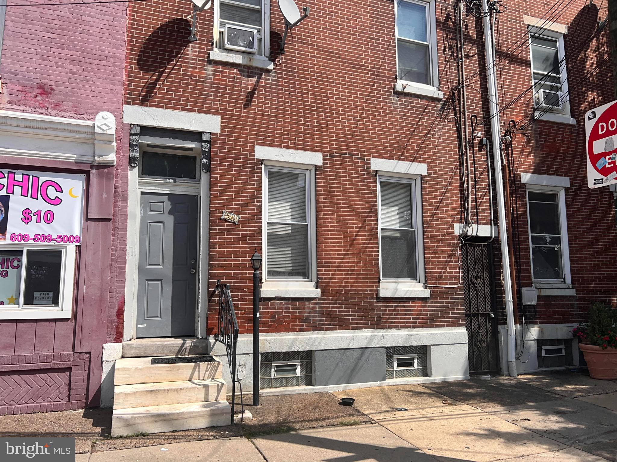 1249 Shackamaxon Street, Unit 3F Philadelphia, PA 19125 - Photo 10 of 12 a front view of a building with street