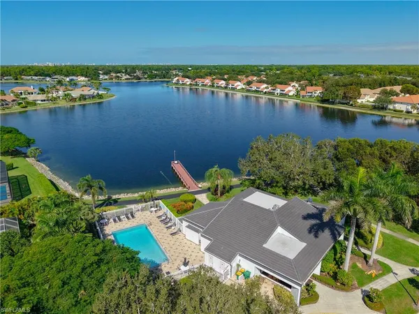 an aerial view of a house with a lake view