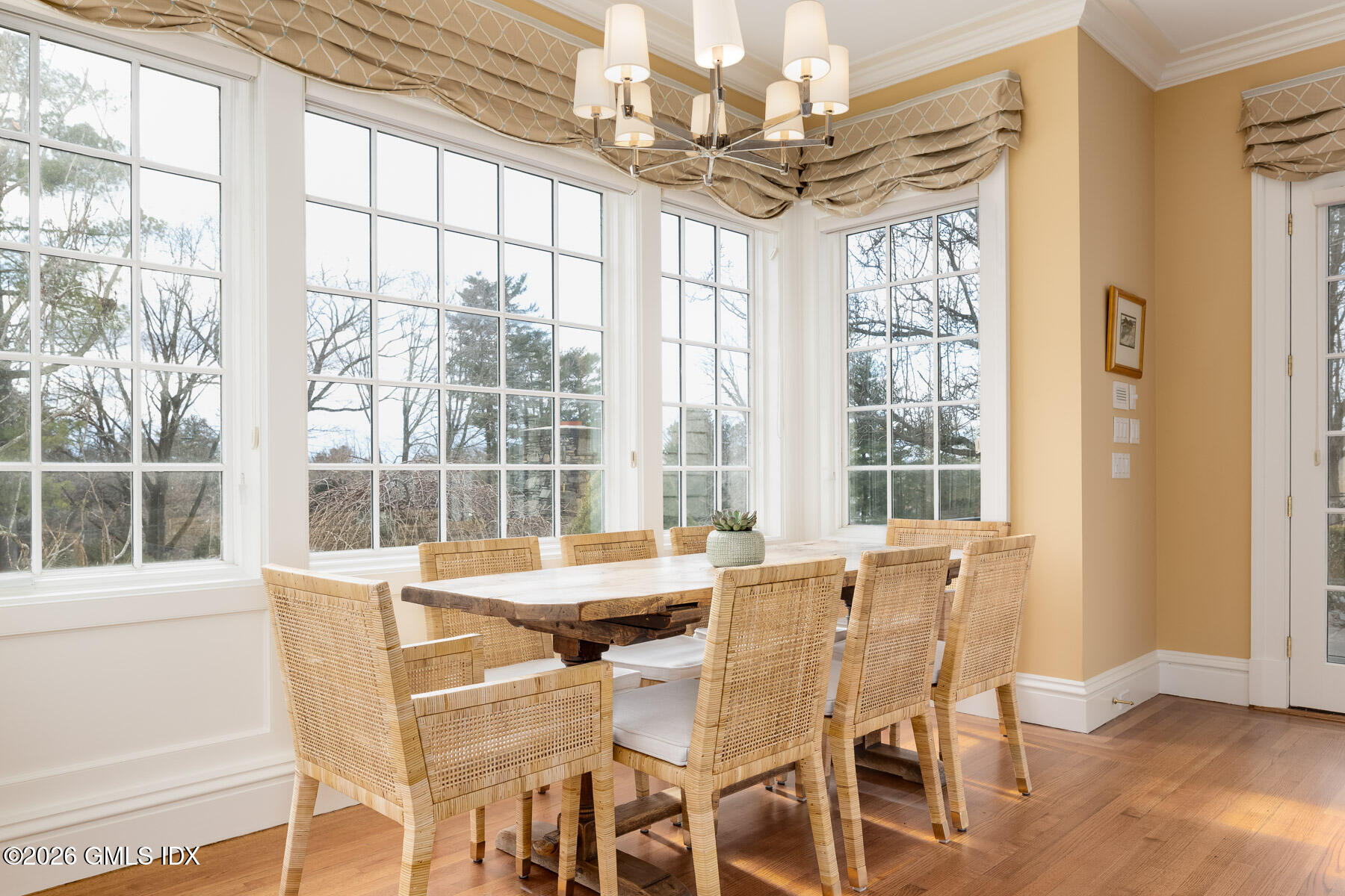 174 Round Hill Road Greenwich, CT 06831 - Photo 13 of 27 a view of a dining room with furniture large windows and wooden floor