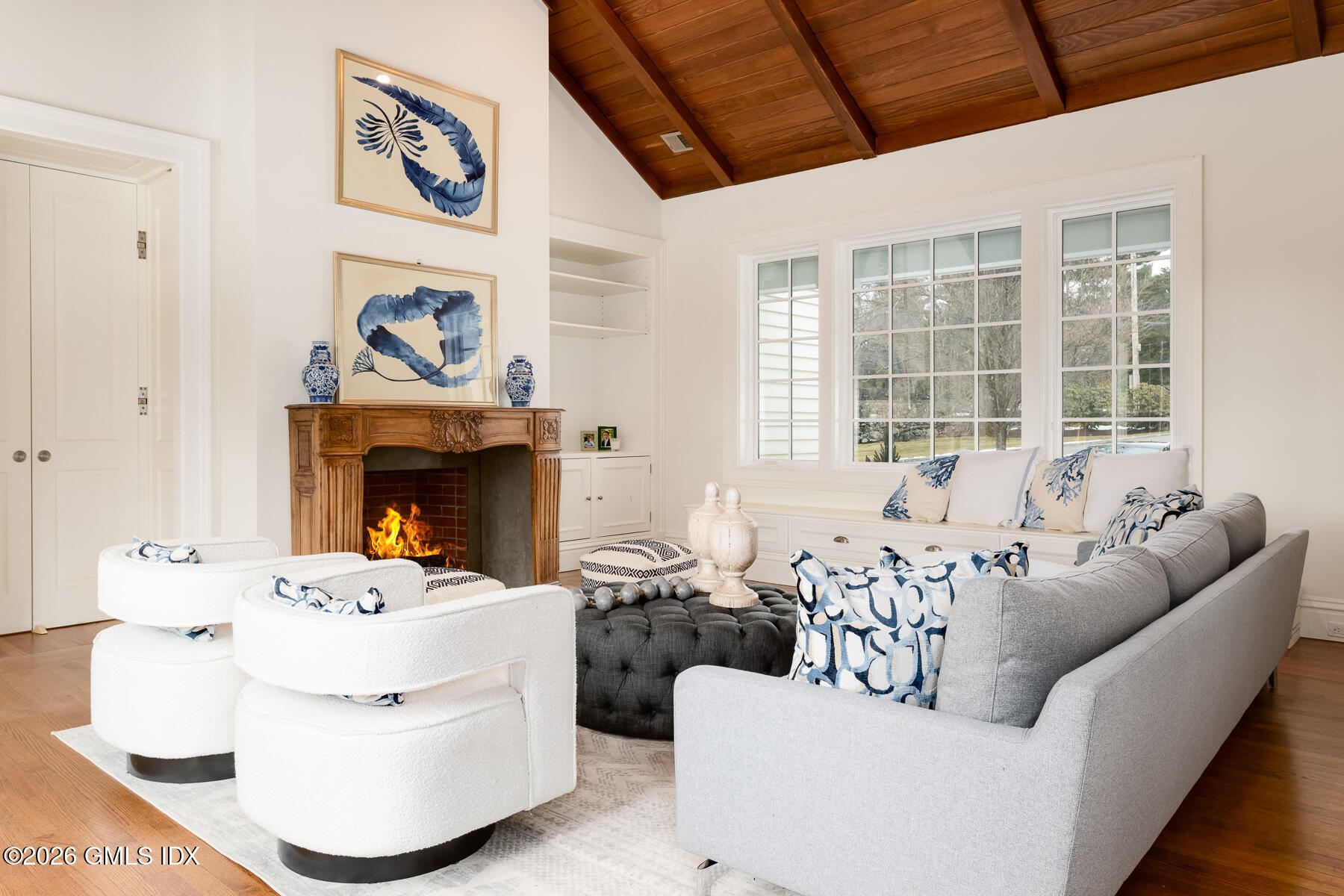 174 Round Hill Road Greenwich, CT 06831 - Photo 14 of 27 a living room with furniture and a fireplace