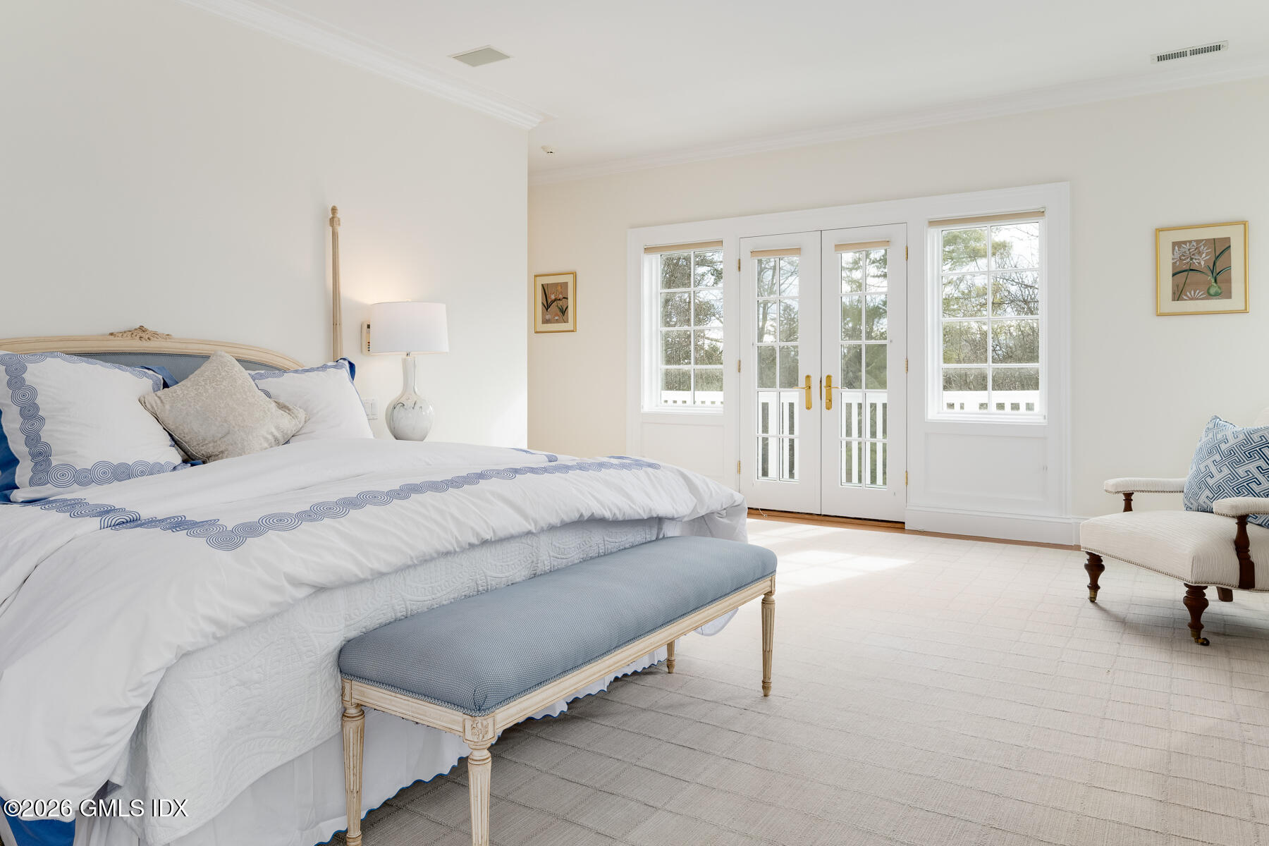 174 Round Hill Road Greenwich, CT 06831 - Photo 15 of 27 a spacious bedroom with a bed and a window