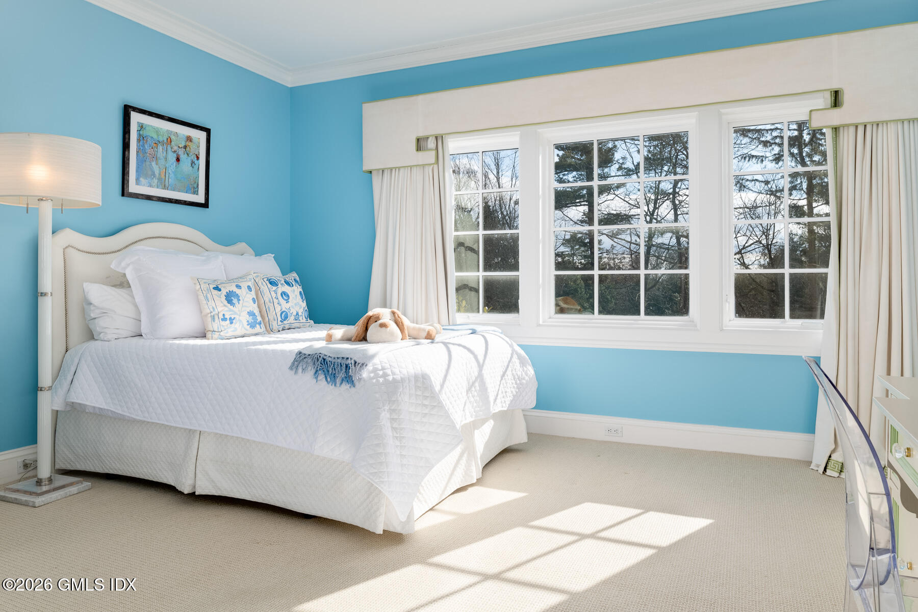 174 Round Hill Road Greenwich, CT 06831 - Photo 17 of 27 a bed sitting in a bedroom next to a window