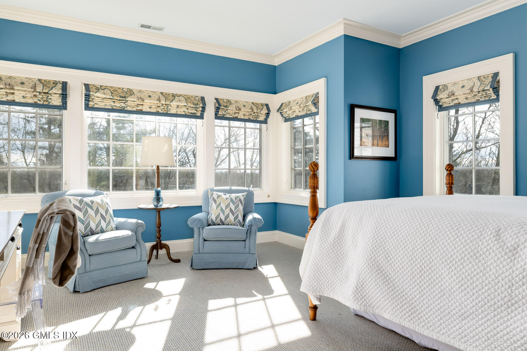 174 Round Hill Road Greenwich, CT 06831 - Photo 19 of 27 a bedroom with furniture and a large window