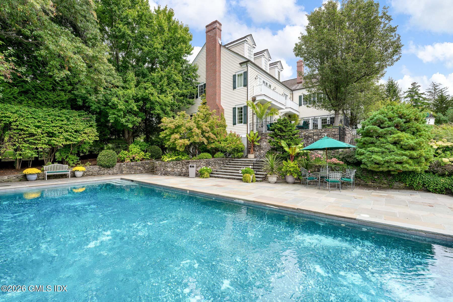 174 Round Hill Road Greenwich, CT 06831 - Photo 22 of 27 a view of a back yard of the house