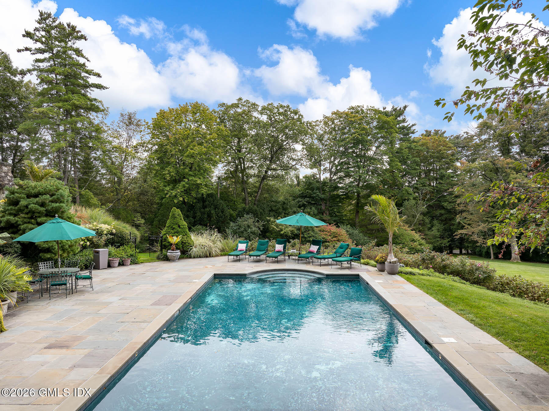 174 Round Hill Road Greenwich, CT 06831 - Photo 3 of 27 a view of yard with swimming pool and sitting area