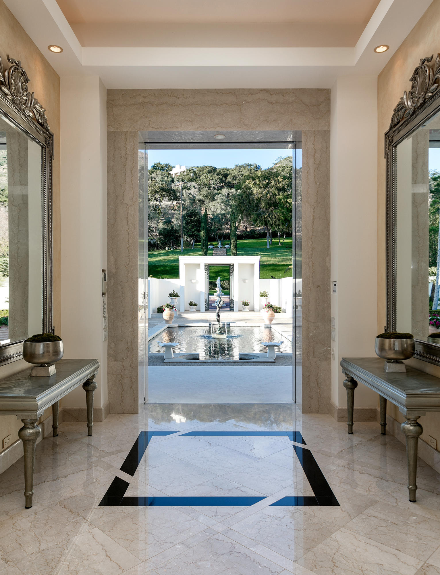 1188 East Mountain Drive Montecito, CA 93108 - Photo 11 of 44 a living room with patio furniture and a large window
