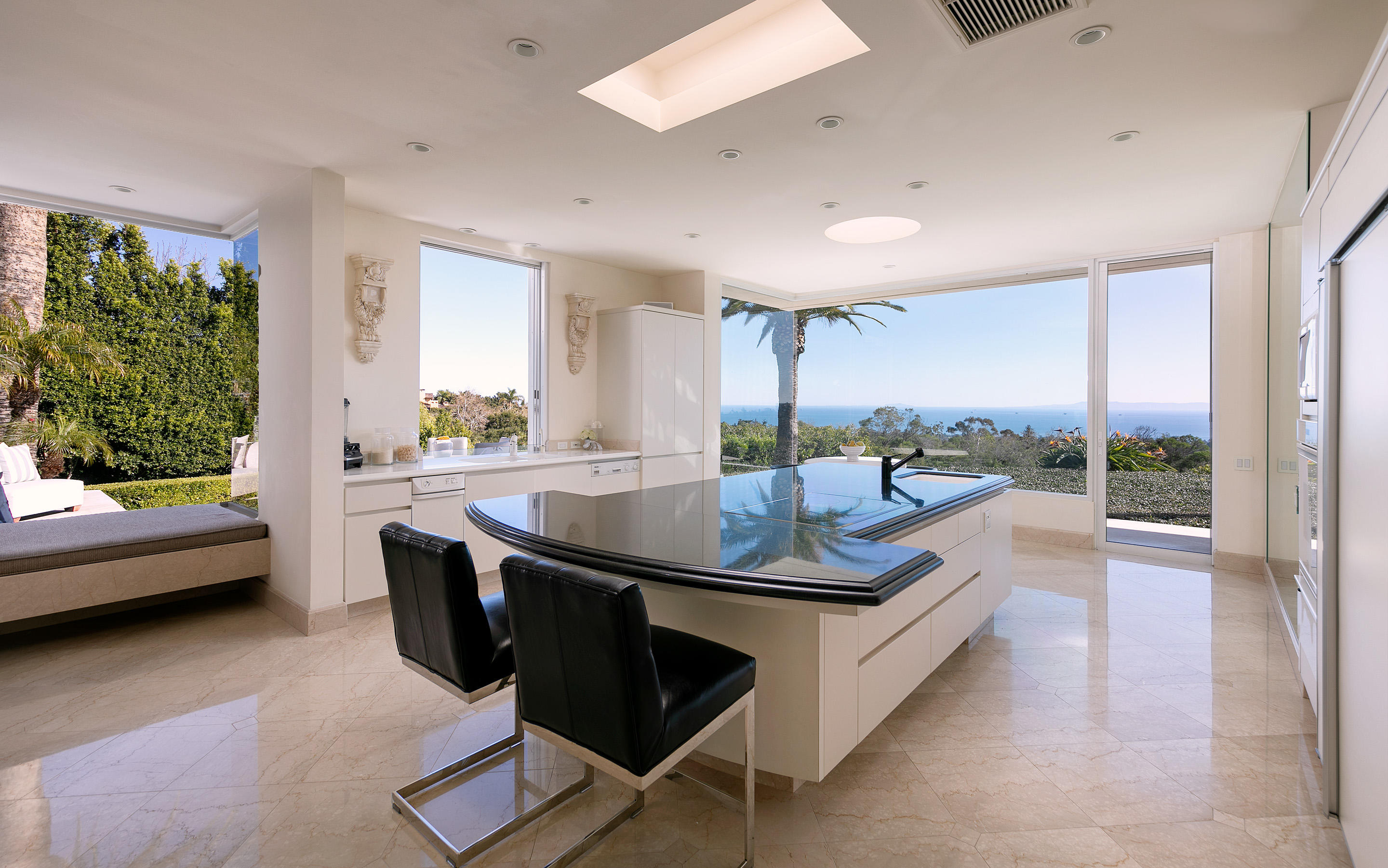 1188 East Mountain Drive Montecito, CA 93108 - Photo 19 of 44 a living room with furniture and a floor to ceiling window