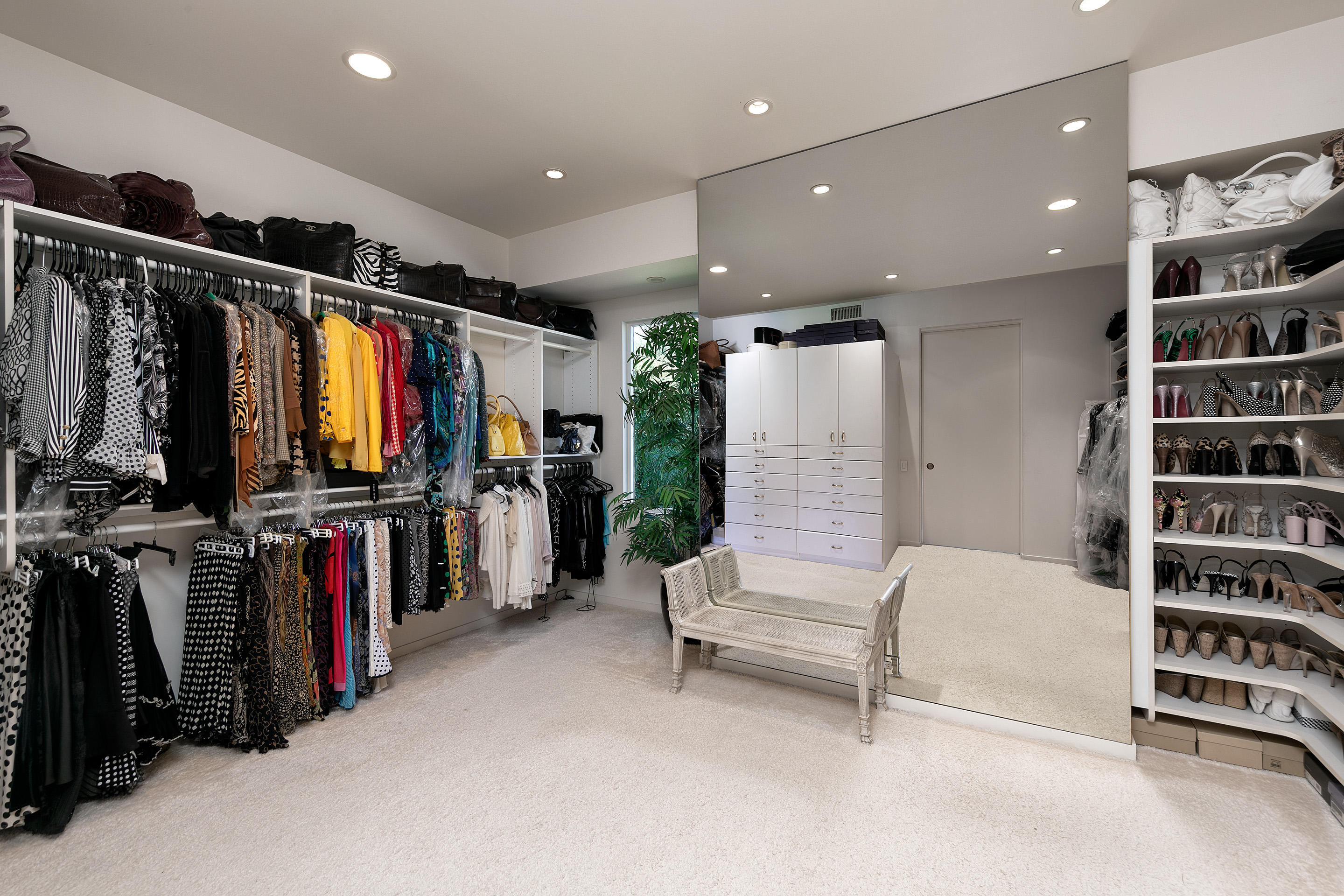 1188 East Mountain Drive Montecito, CA 93108 - Photo 26 of 44 a view of walk in closet with clothes and shoes