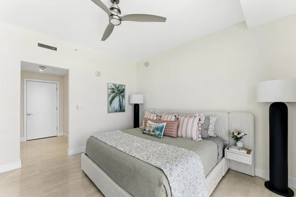 a bedroom with a bed and walk in closet