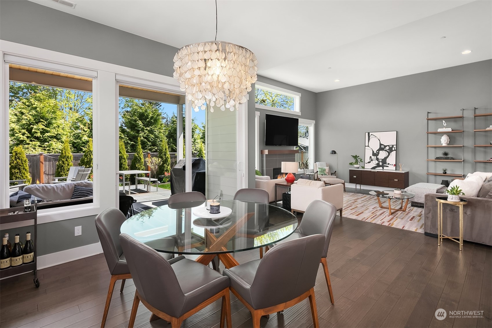 8721 218th Street Southwest Edmonds, WA 98026 - Photo 11 of 34 a dining room with furniture a chandelier and wooden floor