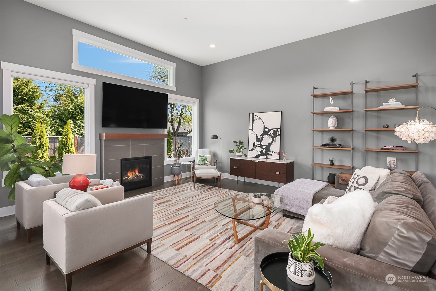 8721 218th Street Southwest Edmonds, WA 98026 - Photo 13 of 34 a living room with furniture fireplace and a flat screen tv