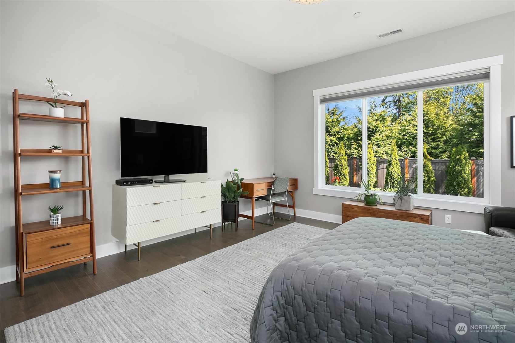 8721 218th Street Southwest Edmonds, WA 98026 - Photo 18 of 34 a bed room with a bed a television and a large window