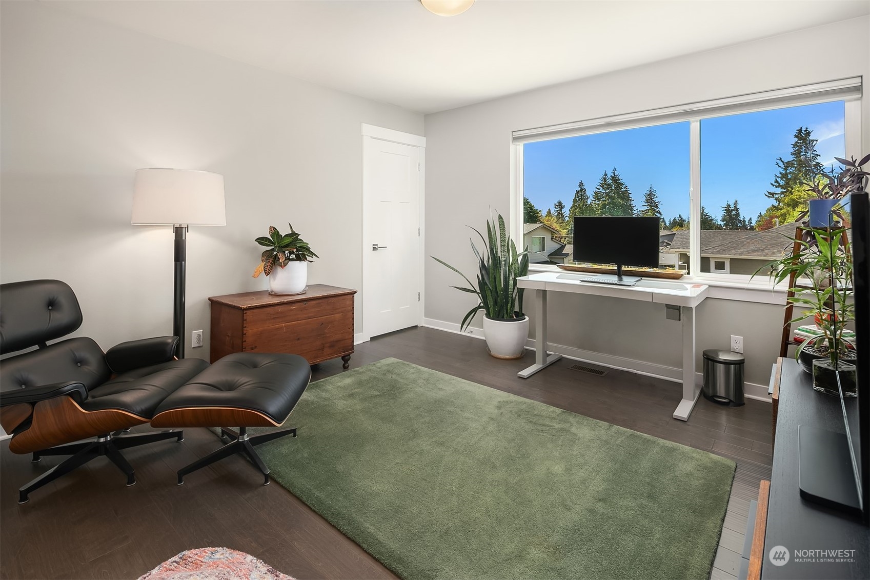 8721 218th Street Southwest Edmonds, WA 98026 - Photo 26 of 34 a living room with furniture a potted plant and a table