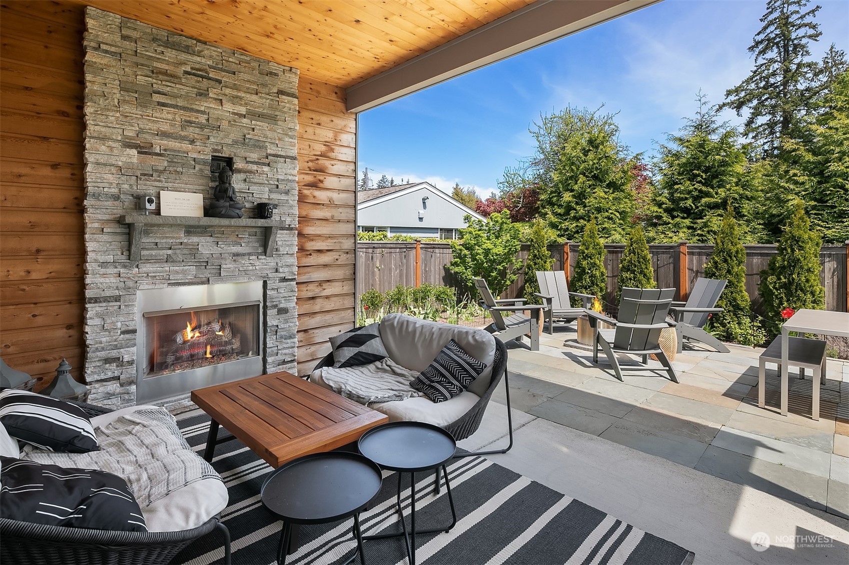 8721 218th Street Southwest Edmonds, WA 98026 - Photo 33 of 34 a view of a patio with couple of chairs and a fire pit