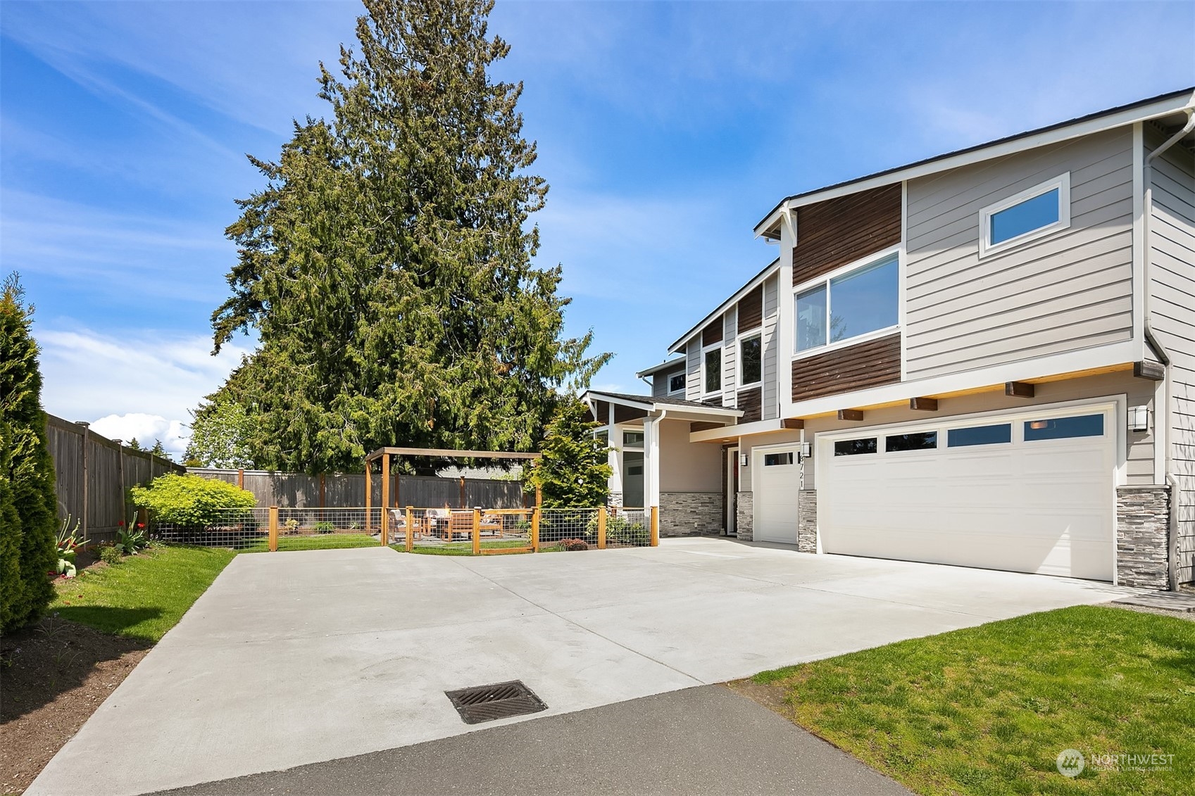 8721 218th Street Southwest Edmonds, WA 98026 - Photo 34 of 34 a front view of a house with a yard and garage