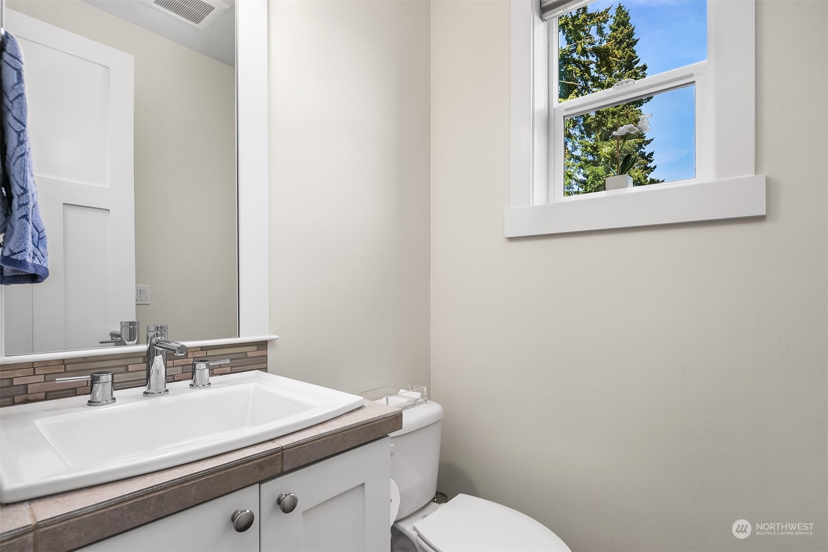 8721 218th Street Southwest Edmonds, WA 98026 - Photo 5 of 34 a bathroom with a sink mirror vanity and toilet
