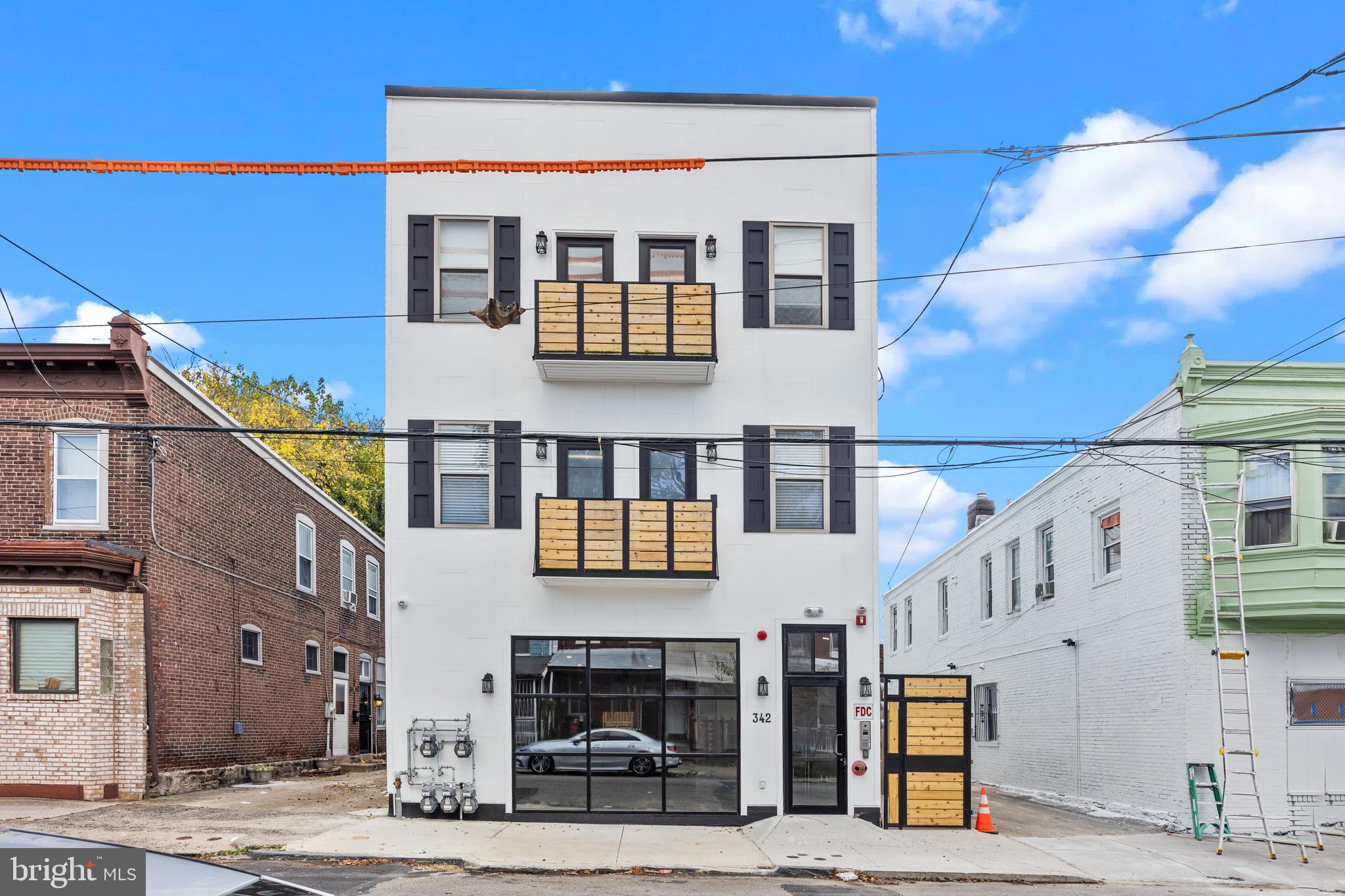 a front view of a building with glass windows