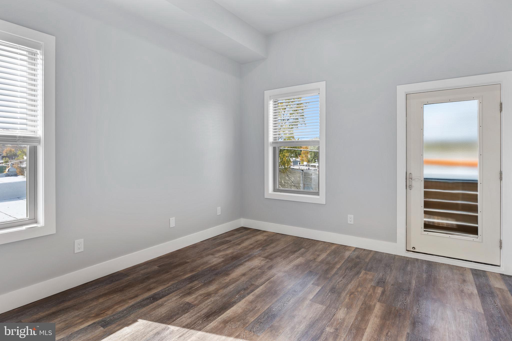 342 West Queen Lane, Unit 5 Philadelphia, PA 19144 - Photo 12 of 18 an empty room with windows