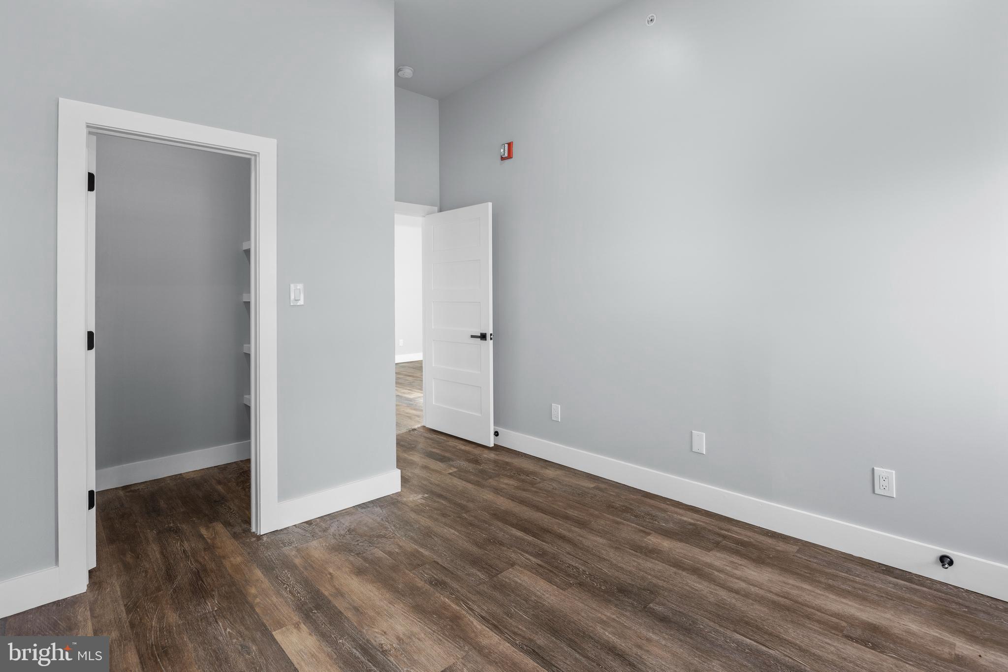 342 West Queen Lane, Unit 5 Philadelphia, PA 19144 - Photo 16 of 18 a view of an empty room with wooden floor